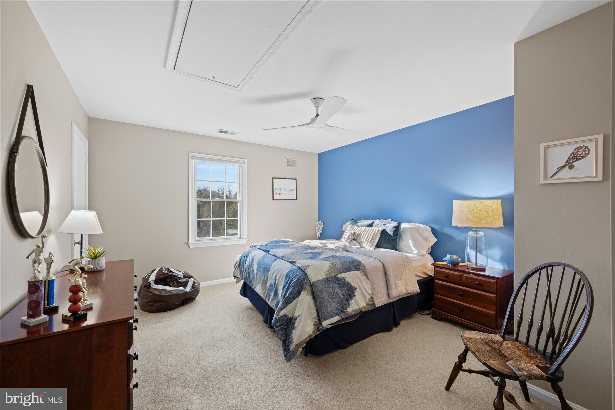 13321 Glen Mill Road Rockville, MD 20850 - Photo 20 of 31 a bedroom with a bed chair and dresser