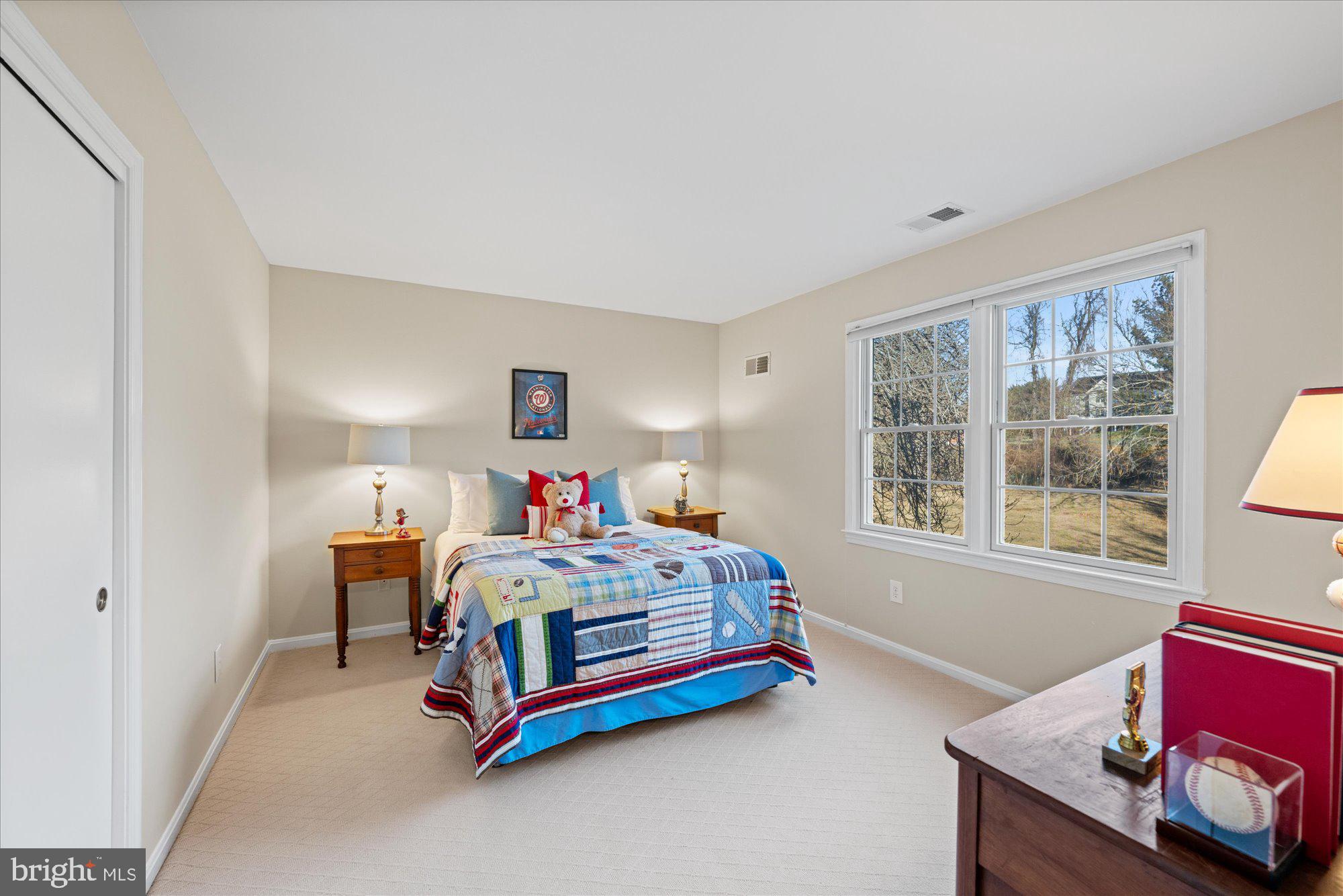 13321 Glen Mill Road Rockville, MD 20850 - Photo 23 of 31 a bed room with a bed and a window