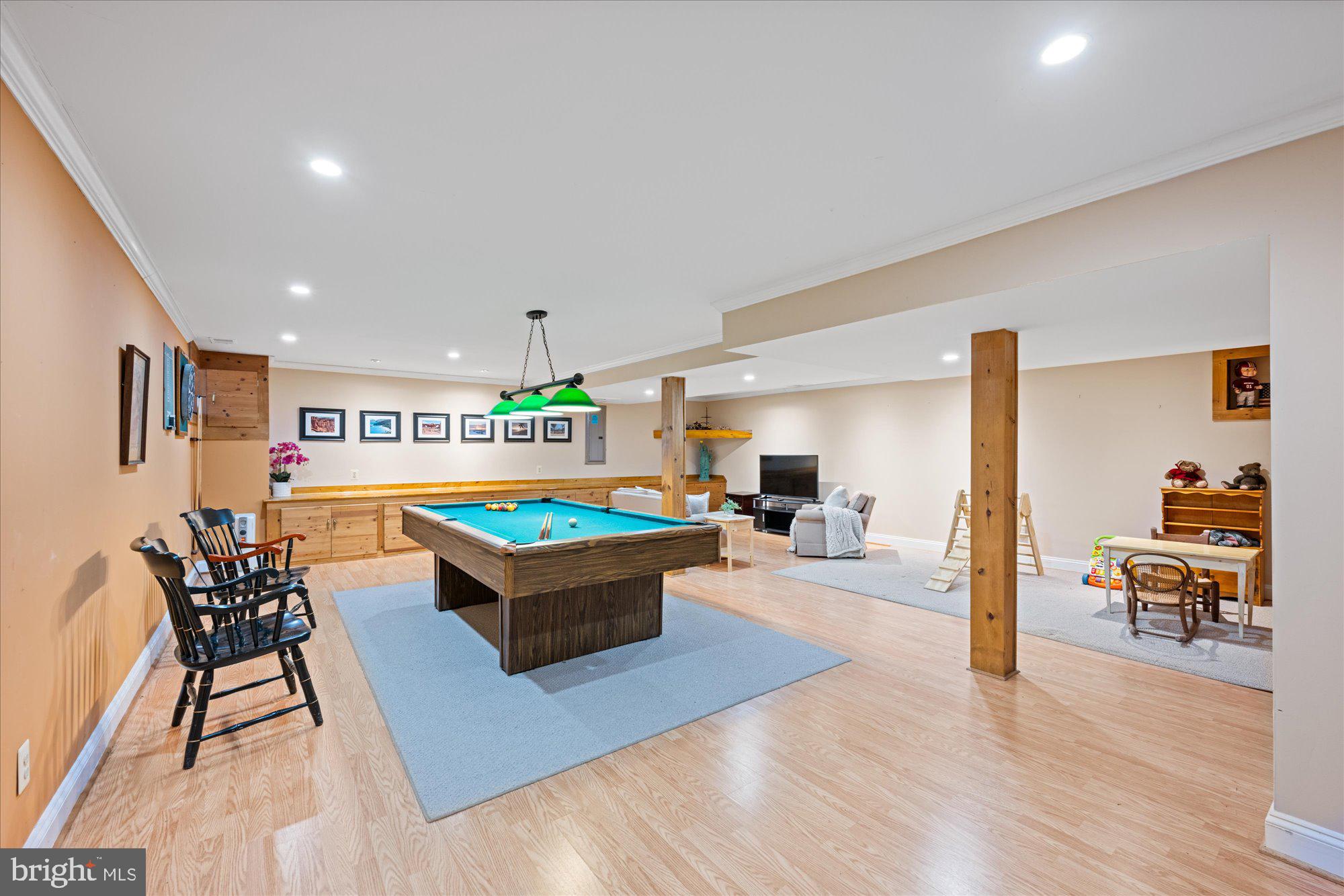 13321 Glen Mill Road Rockville, MD 20850 - Photo 25 of 31 a living room with furniture a table and wooden floor