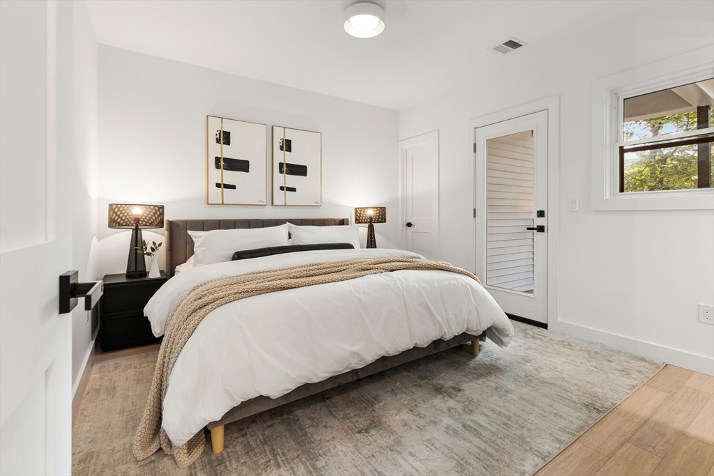 6 Wyman Court, Unit 6 Winchester, MA 01890 - Photo 15 of 35 a bedroom with a bed and a night stand