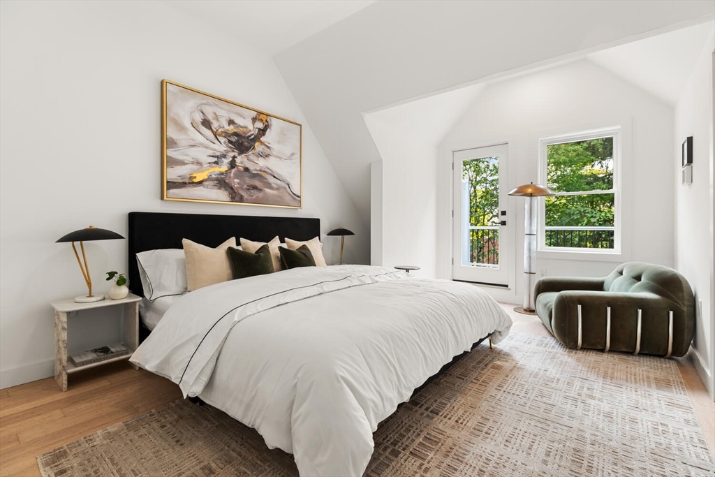 6 Wyman Court, Unit 6 Winchester, MA 01890 - Photo 18 of 35 a bedroom with bed window and wall painting