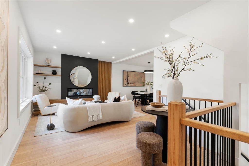 6 Wyman Court, Unit 6 Winchester, MA 01890 - Photo 2 of 35 a living room with furniture a rug and a window