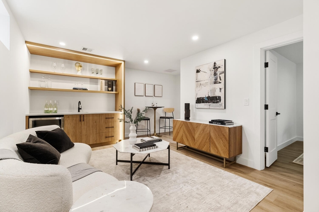 6 Wyman Court, Unit 6 Winchester, MA 01890 - Photo 21 of 35 a living room with furniture and a rug