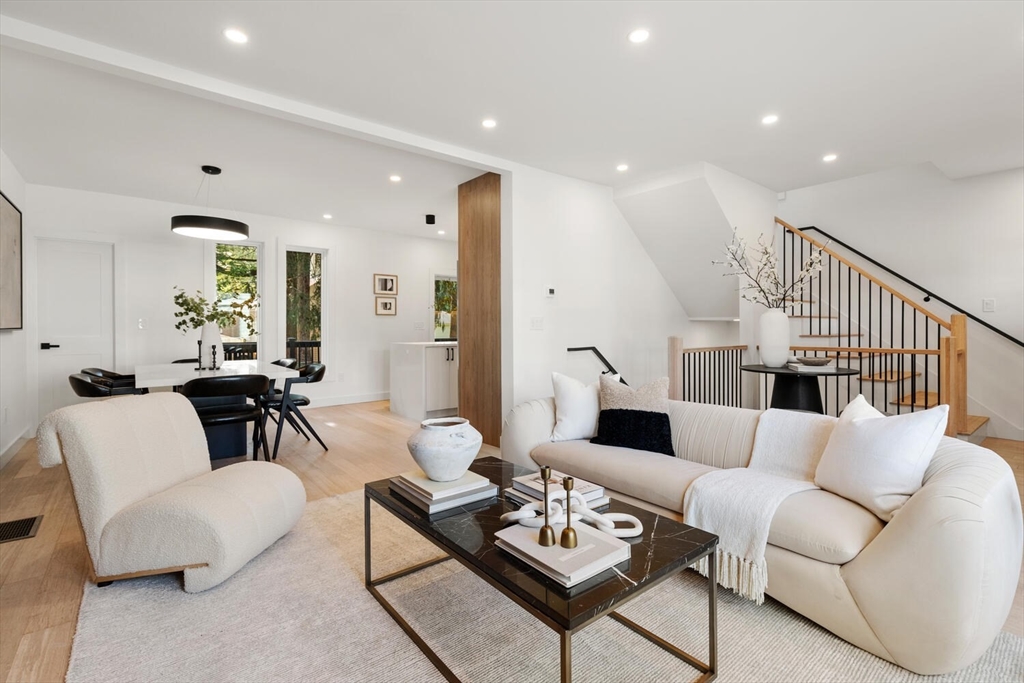 6 Wyman Court, Unit 6 Winchester, MA 01890 - Photo 3 of 35 a living room with furniture kitchen view and a table