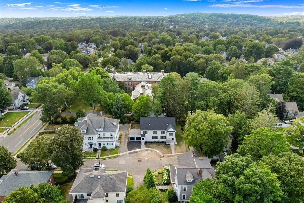 6 Wyman Court, Unit 6 Winchester, MA 01890 - Photo 32 of 35 an aerial view of residential houses with outdoor space and trees