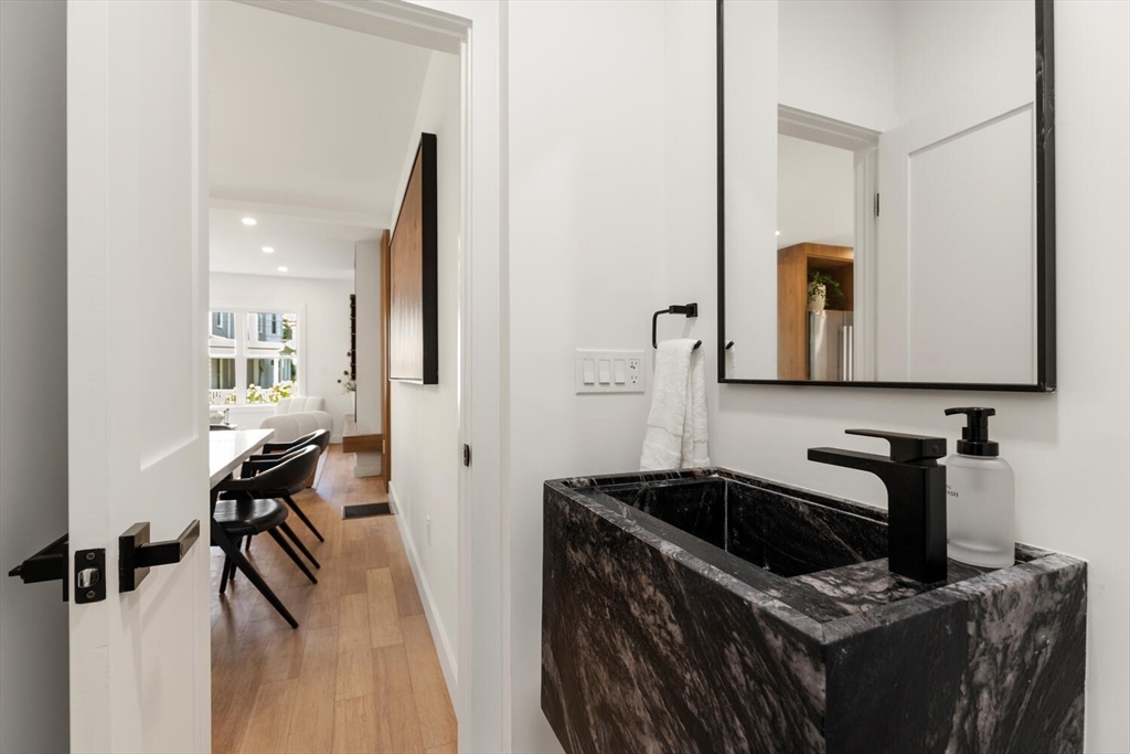 6 Wyman Court, Unit 6 Winchester, MA 01890 - Photo 10 of 35 a kitchen with sink cabinets and stove