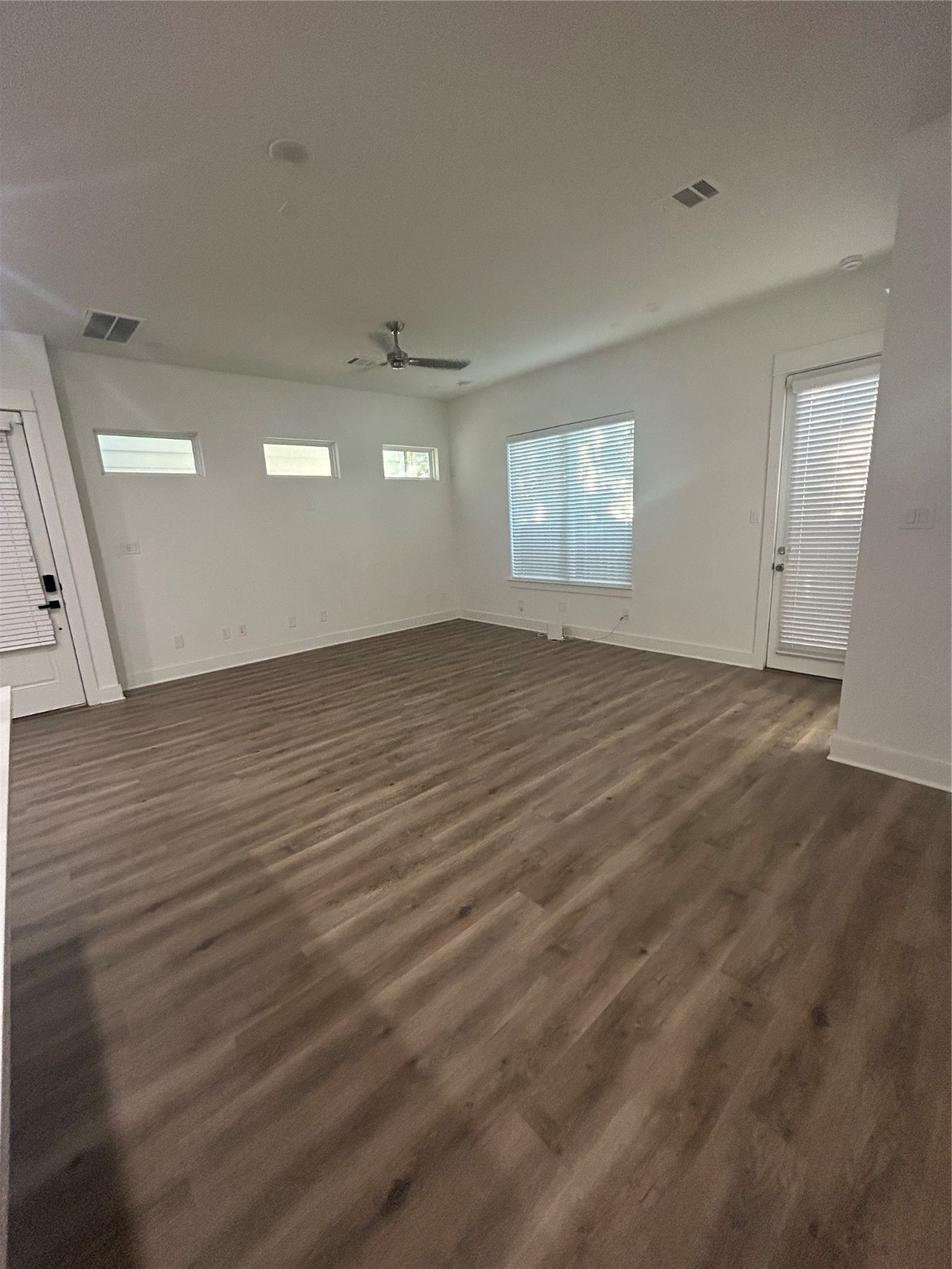 4605 Lavatera Street Houston, TX 77018 - Photo 15 of 50 an empty room with wooden floor and windows