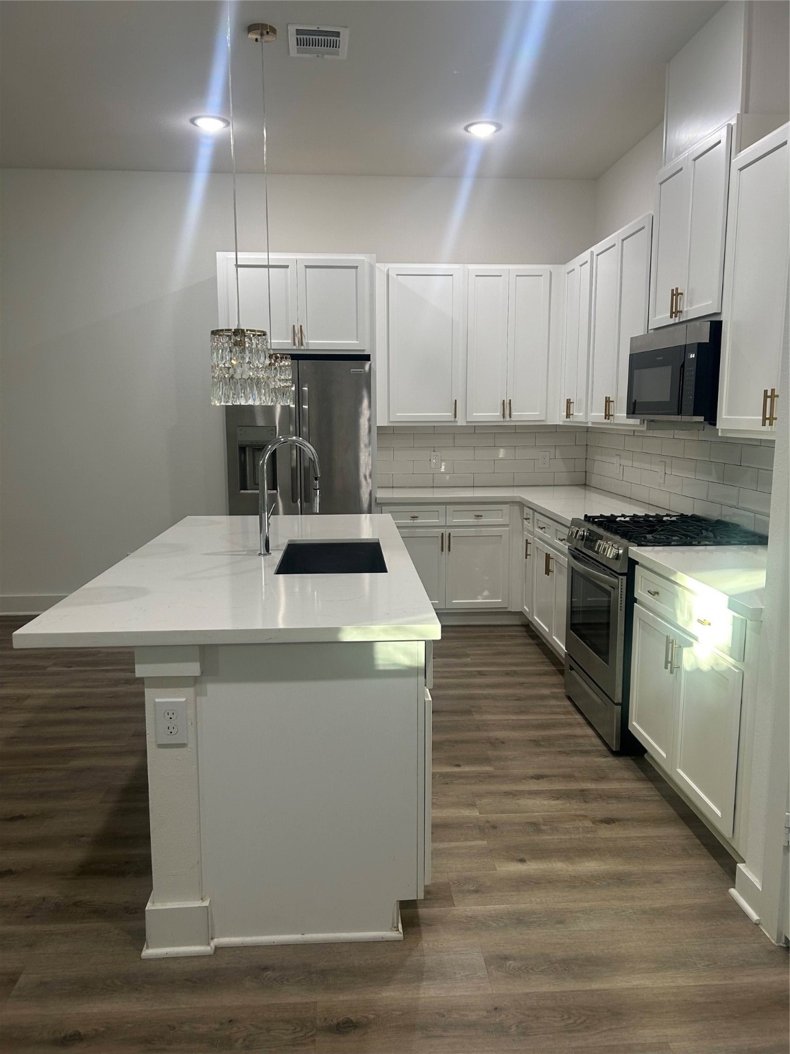 4605 Lavatera Street Houston, TX 77018 - Photo 16 of 50 a kitchen with a sink a stove and oven