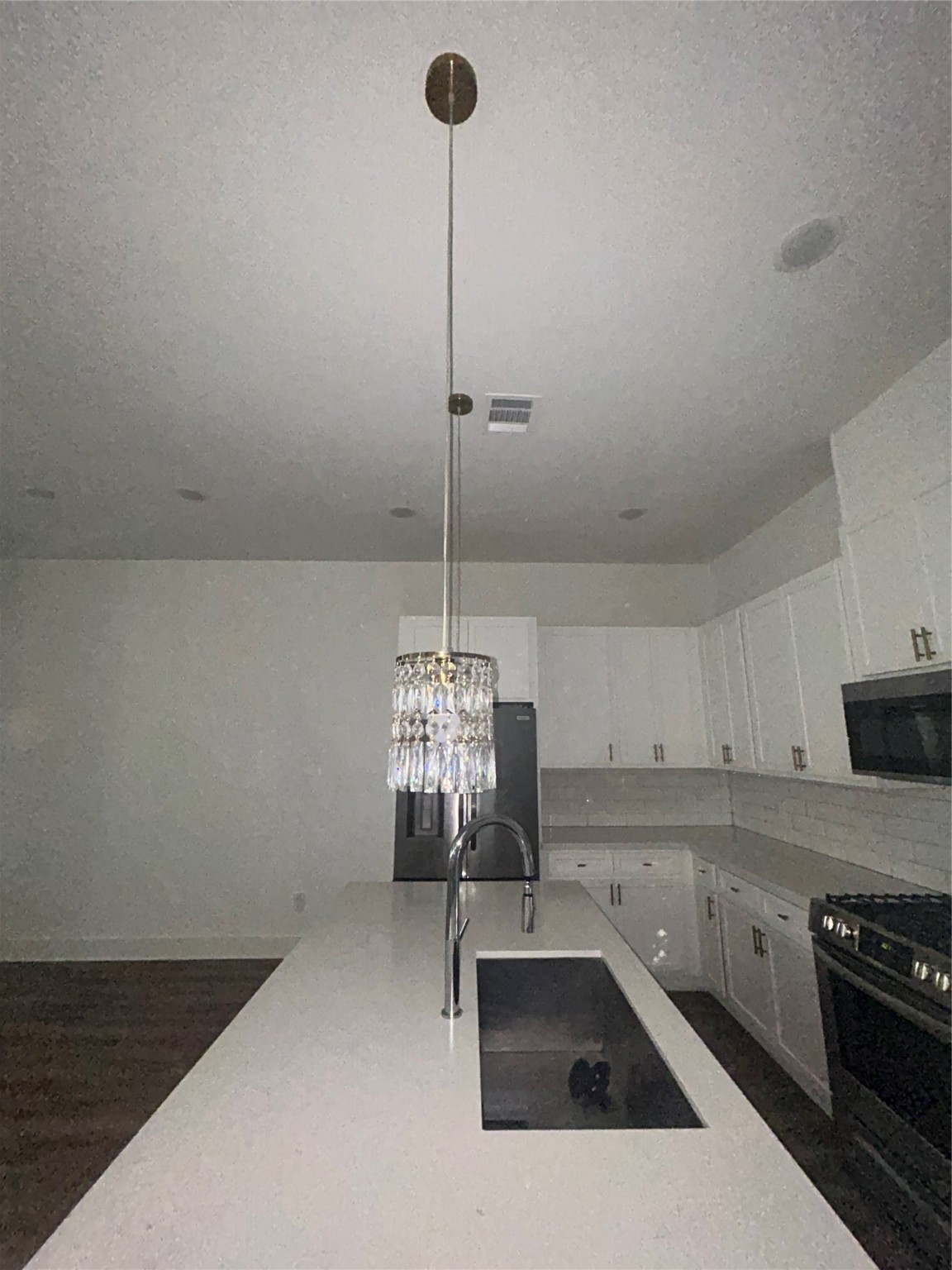 4605 Lavatera Street Houston, TX 77018 - Photo 19 of 50 a kitchen with a sink stove and cabinets