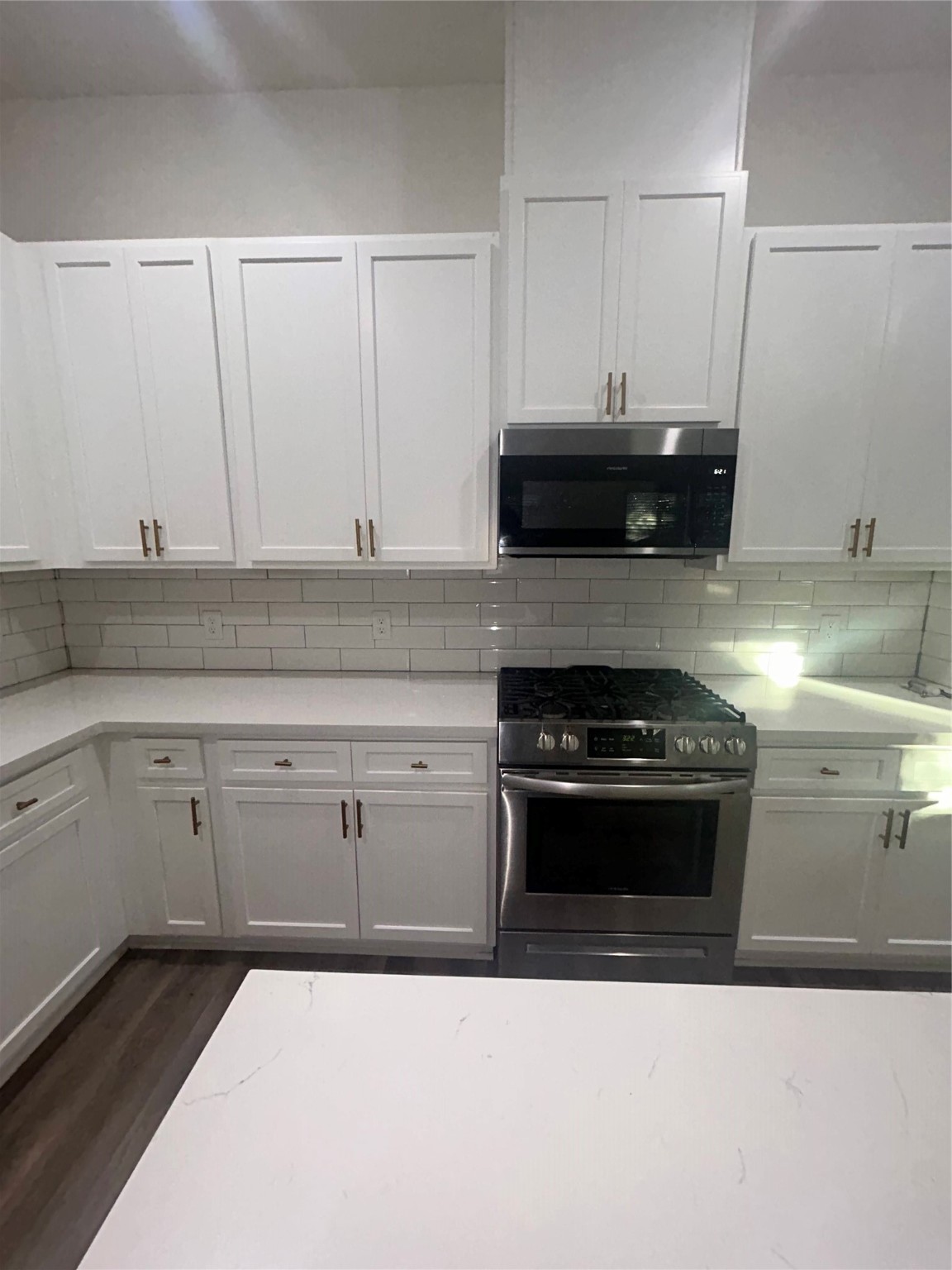4605 Lavatera Street Houston, TX 77018 - Photo 25 of 50 a kitchen with a stove and white cabinets