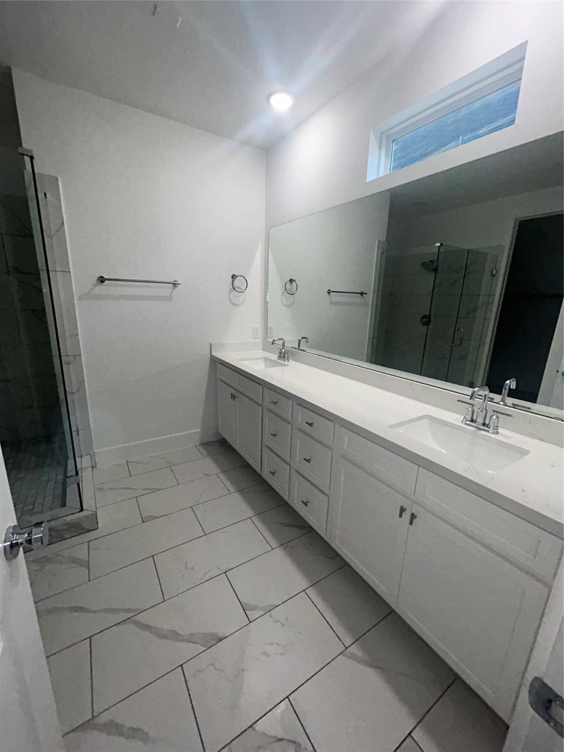 4605 Lavatera Street Houston, TX 77018 - Photo 41 of 50 a bathroom with a double vanity sink a mirror and a shower