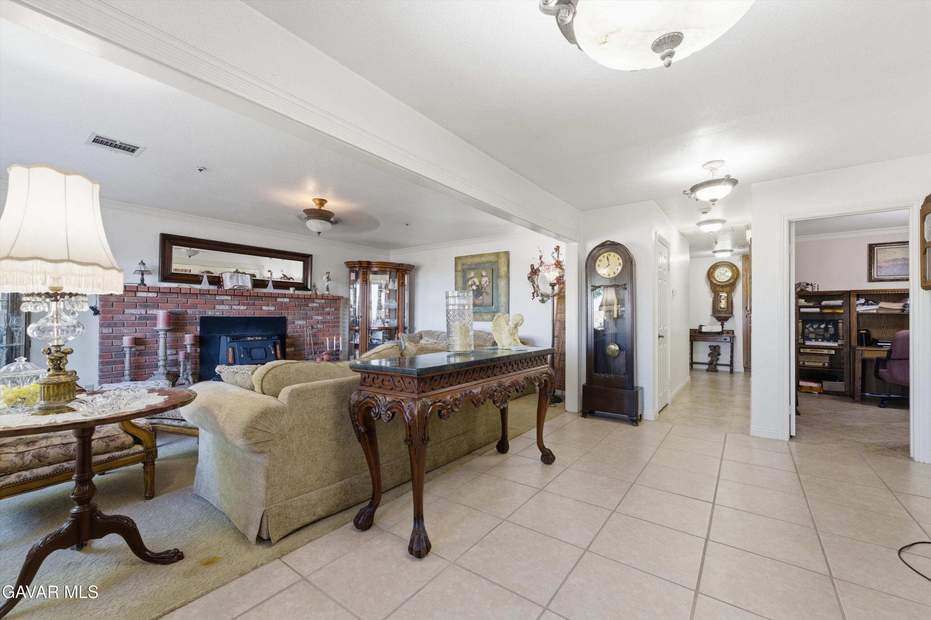 5801 Hacienda Ranch Road Palmdale, CA 93551 - Photo 23 of 69 a living room with furniture and a kitchen