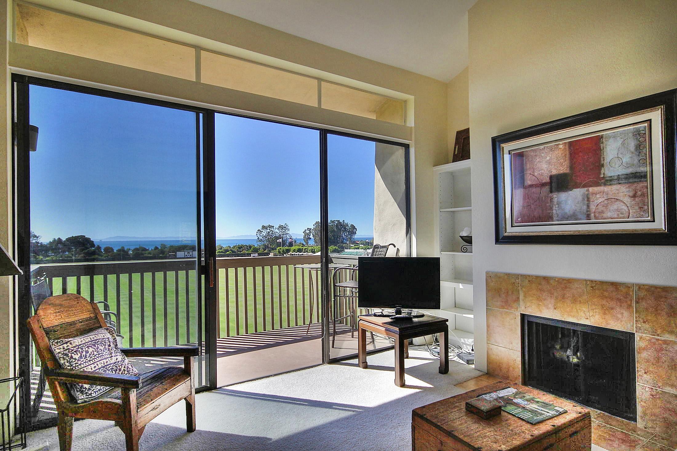 3375 Foothill Road, Unit 532 Carpinteria, CA 93013 - Photo 3 of 13 a living room with furniture and a fireplace