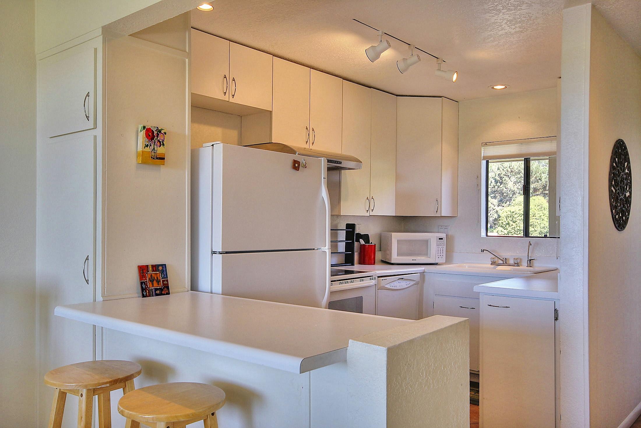 3375 Foothill Road, Unit 532 Carpinteria, CA 93013 - Photo 4 of 13 a kitchen with refrigerator and cabinets