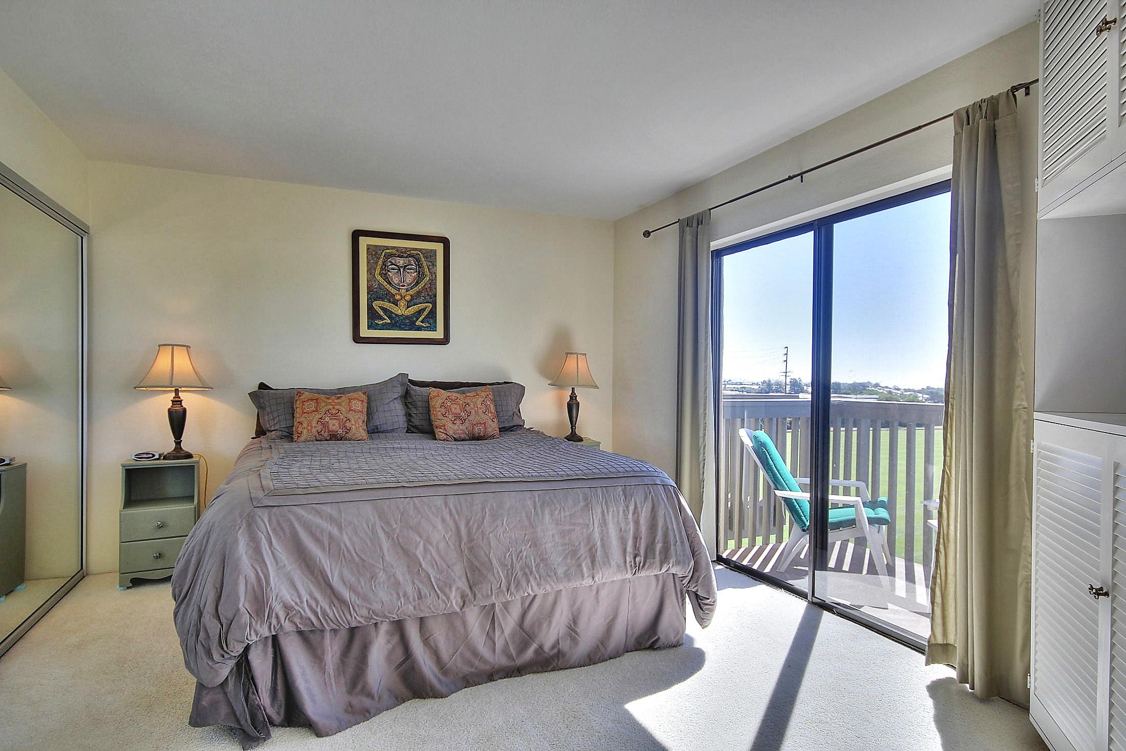 3375 Foothill Road, Unit 532 Carpinteria, CA 93013 - Photo 6 of 13 a bedroom with a large bed and a large window