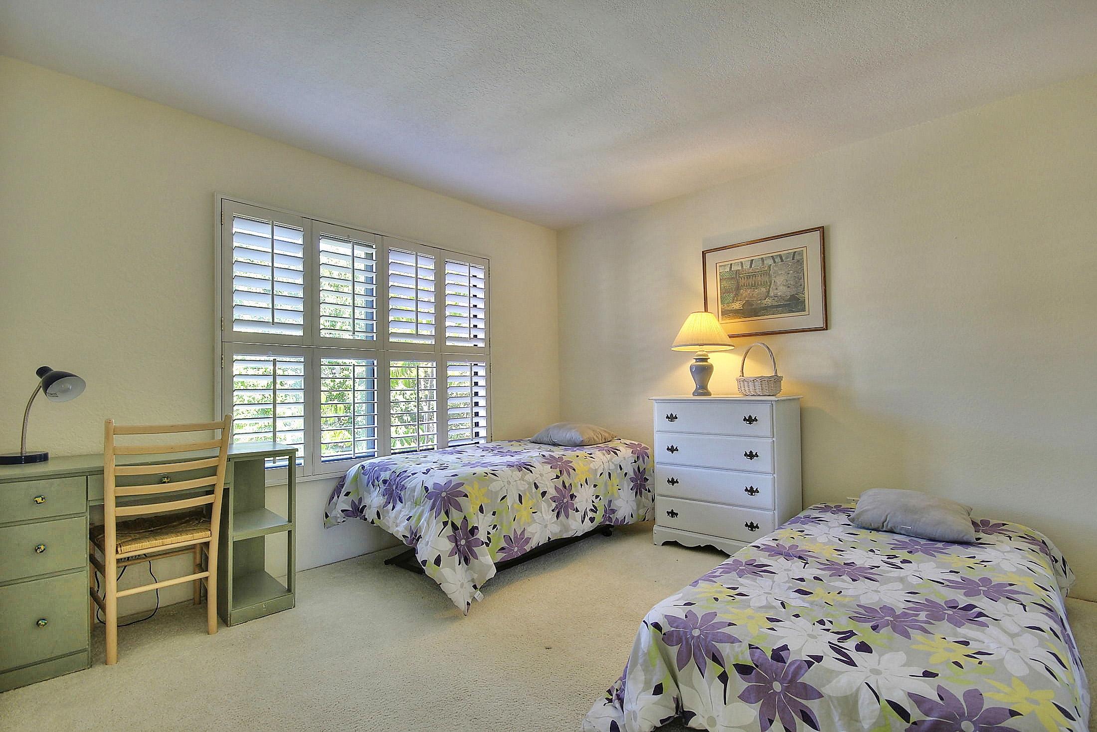 3375 Foothill Road, Unit 532 Carpinteria, CA 93013 - Photo 8 of 13 a bedroom with two beds and a dresser