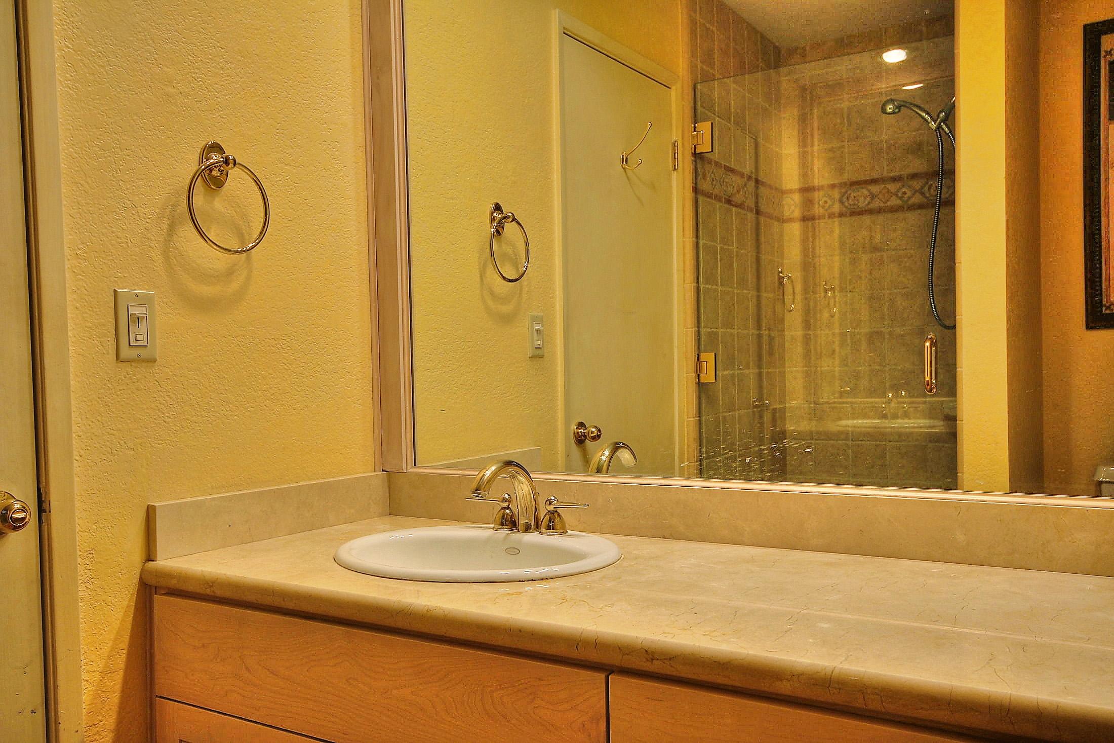 3375 Foothill Road, Unit 532 Carpinteria, CA 93013 - Photo 10 of 13 a bathroom with a sink and a mirror