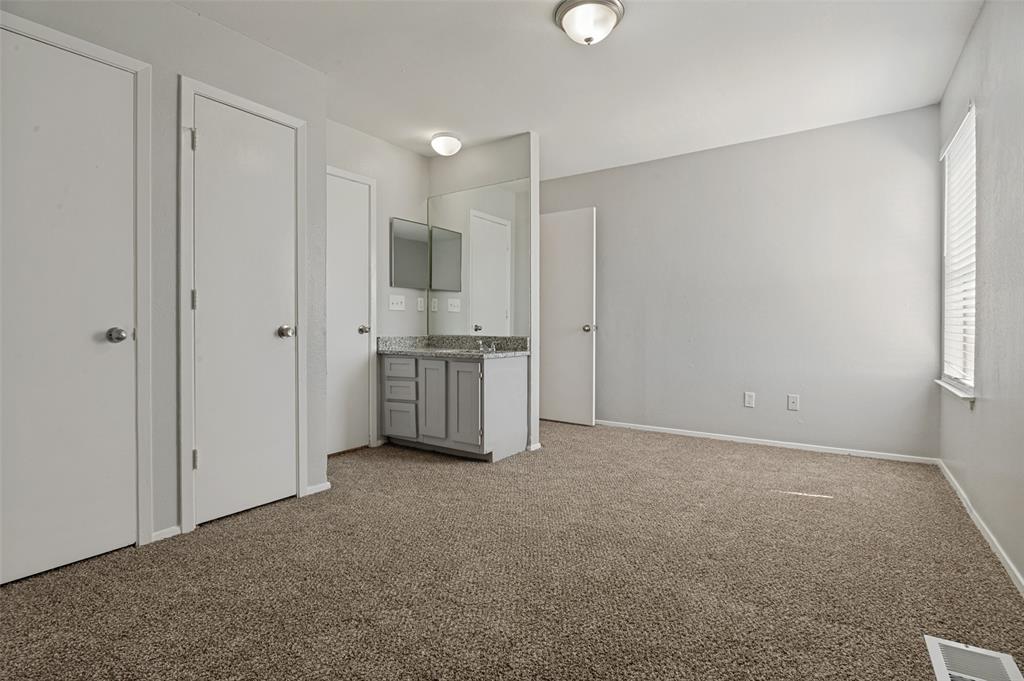 622 West Union Bower Road Irving, TX 75061 - Photo 11 of 13 Room featuring light gray walls, brown carpet, and white trim