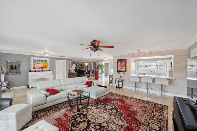 a large kitchen with stainless steel appliances granite countertop a sink and dishwasher a stove top oven with white cabinets