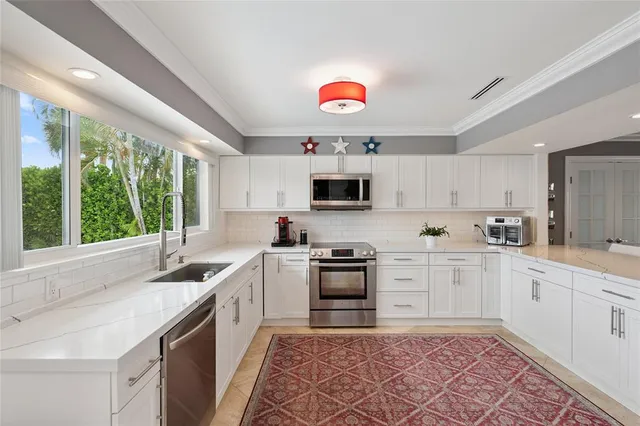a bedroom with a bed and a view of kitchen