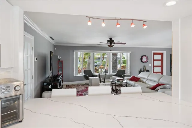 a bathroom with a sink a toilet a mirror and shower