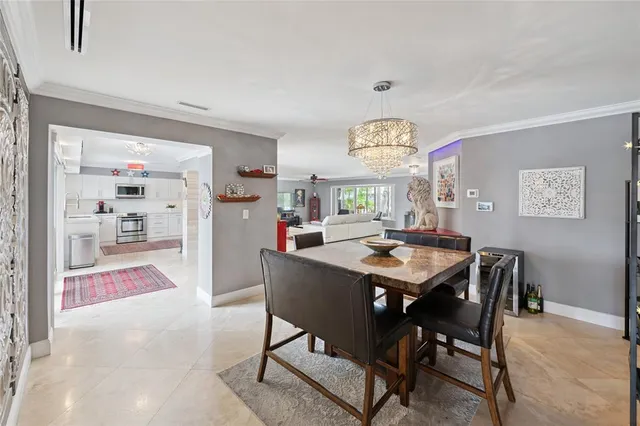 a bedroom with a bed and a large window with the outer view