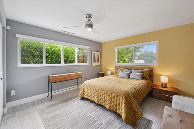a view of a chair and table in backyard of the house