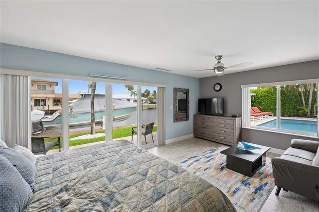 a view of a house with a swimming pool and sitting area