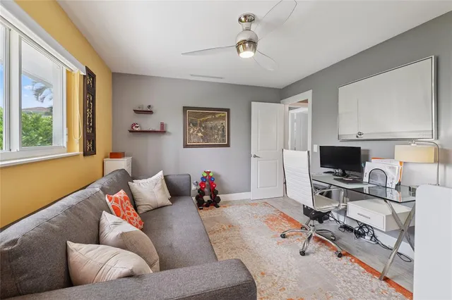 a view of a lake with a yard and a terrace