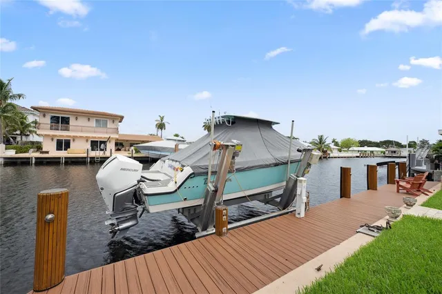 an aerial view of residential houses with city view