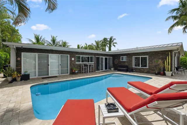 a view of a swimming pool with a patio