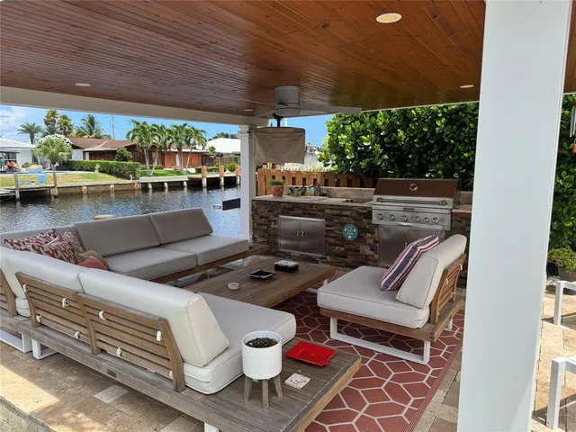 an aerial view of a city with lots of residential buildings ocean and boats