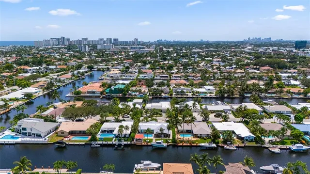a living room with furniture flat screen tv and a fireplace