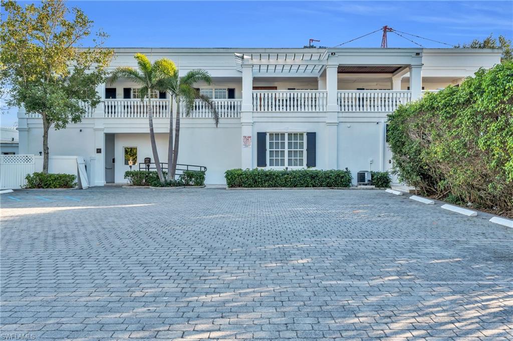 271 Broad Avenue South, Unit 202 Naples, FL 34102 - Photo 18 of 18 a front view of a house