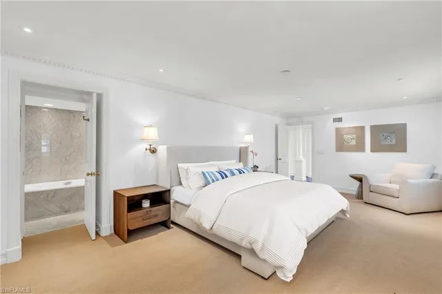 a bedroom with a bed and a couch