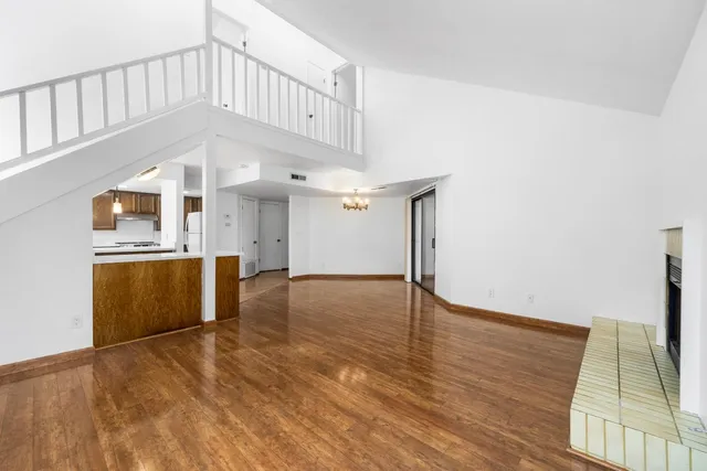 a view of a kitchen with wooden floor