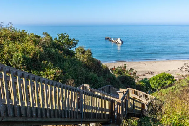an aerial view of beach and ocean