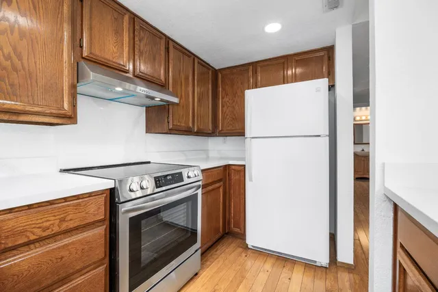 a kitchen with a stove a washer and dryer