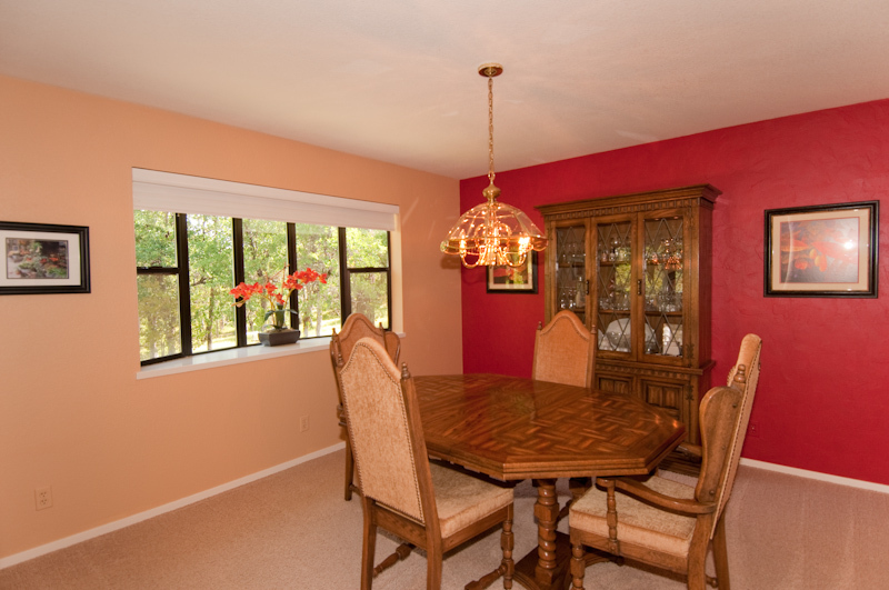 16433 Lower Springs Road Redding, CA 96001 - Photo 4 of 17 a view of a dining room with furniture window and wooden floor