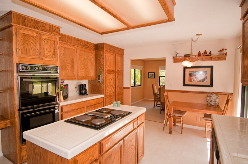 16433 Lower Springs Road Redding, CA 96001 - Photo 6 of 17 a kitchen with a stove a sink and a refrigerator