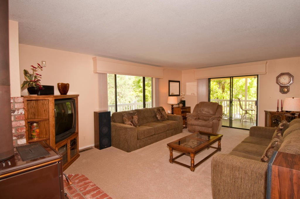 16433 Lower Springs Road Redding, CA 96001 - Photo 7 of 17 a living room with furniture window and flat screen tv