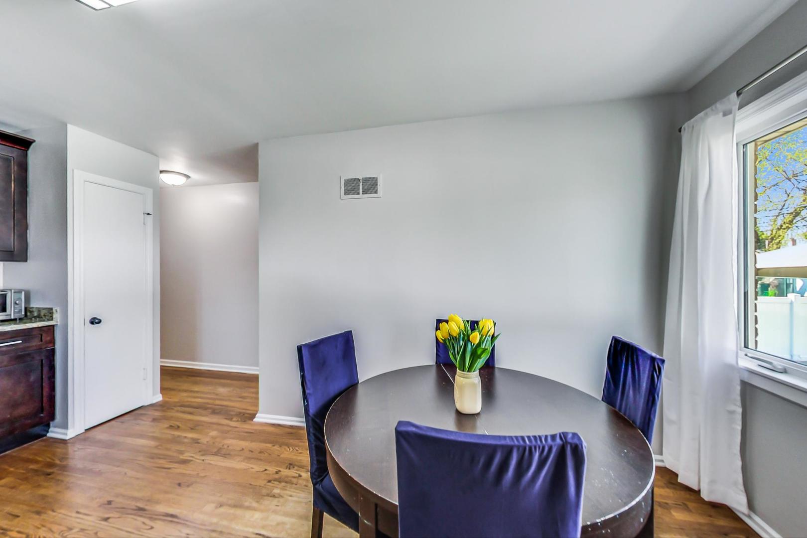 7524 East Prairie Road Skokie, IL 60076 - Photo 13 of 55 a view of a dining room with furniture