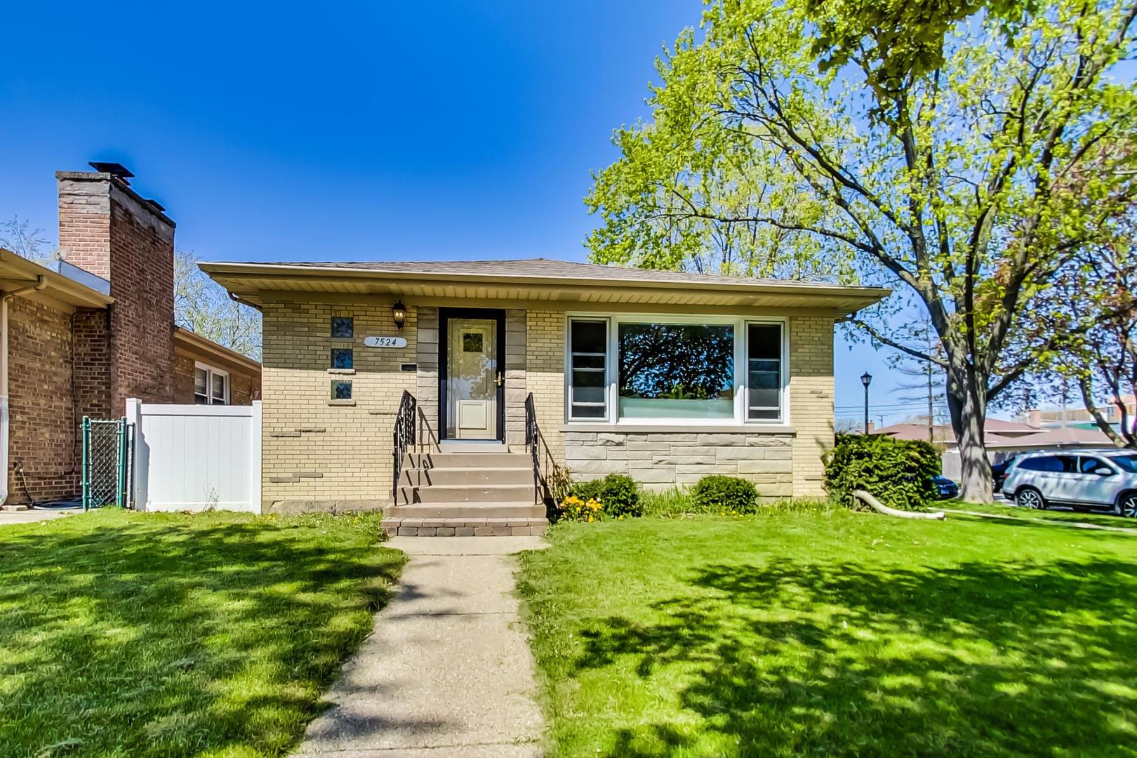 7524 East Prairie Road Skokie, IL 60076 - Photo 2 of 55 a front view of a house with garden