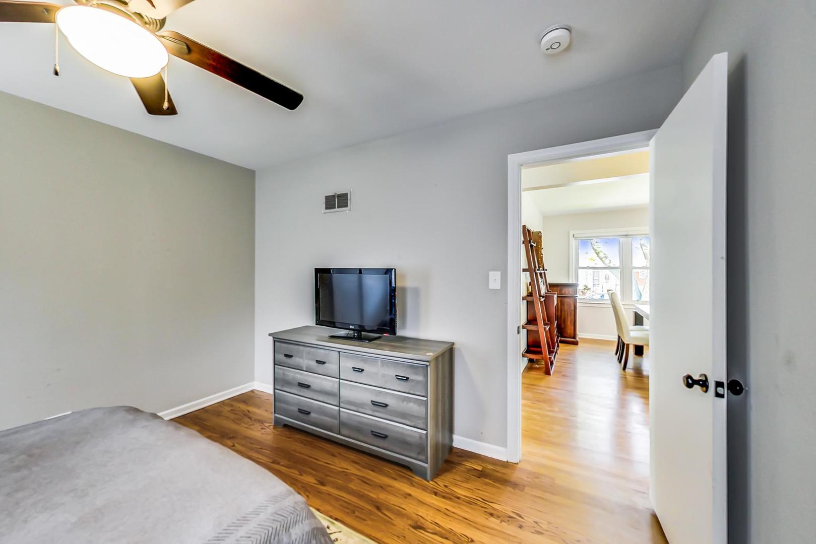 7524 East Prairie Road Skokie, IL 60076 - Photo 21 of 55 a living room with furniture and a flat screen tv