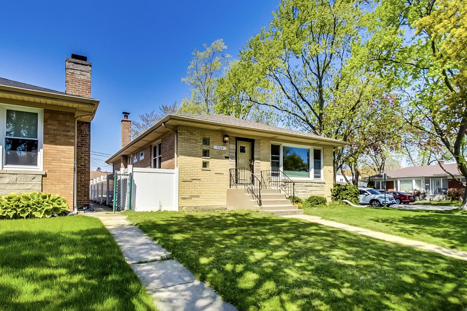 7524 East Prairie Road Skokie, IL 60076 - Photo 3 of 55 a front view of house with yard and green space