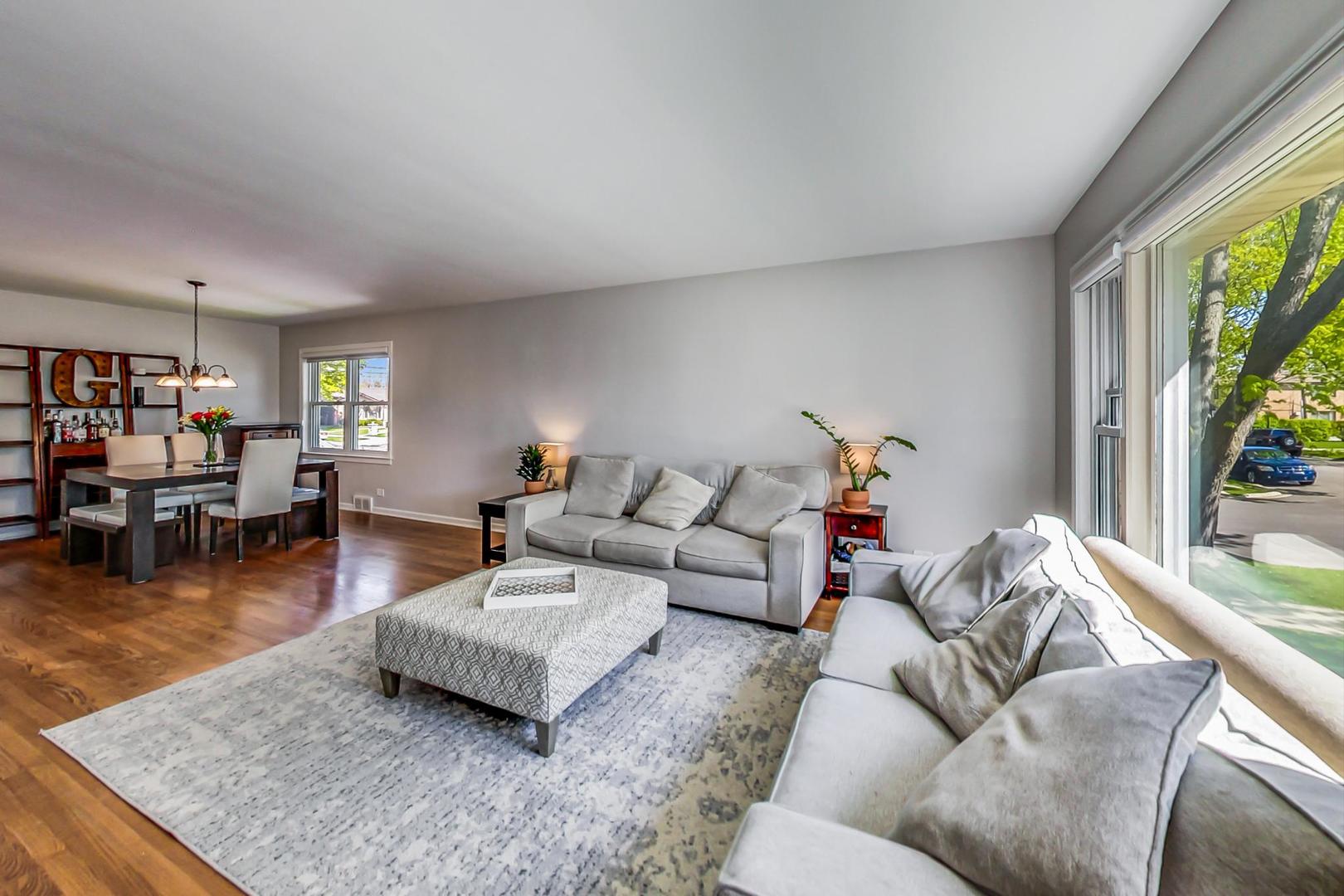 7524 East Prairie Road Skokie, IL 60076 - Photo 6 of 55 a living room with furniture and a table
