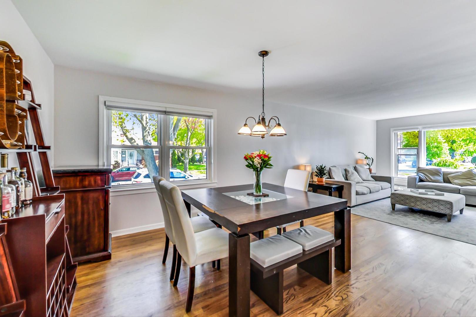 7524 East Prairie Road Skokie, IL 60076 - Photo 9 of 55 a view of a dining room with furniture window and wooden floor