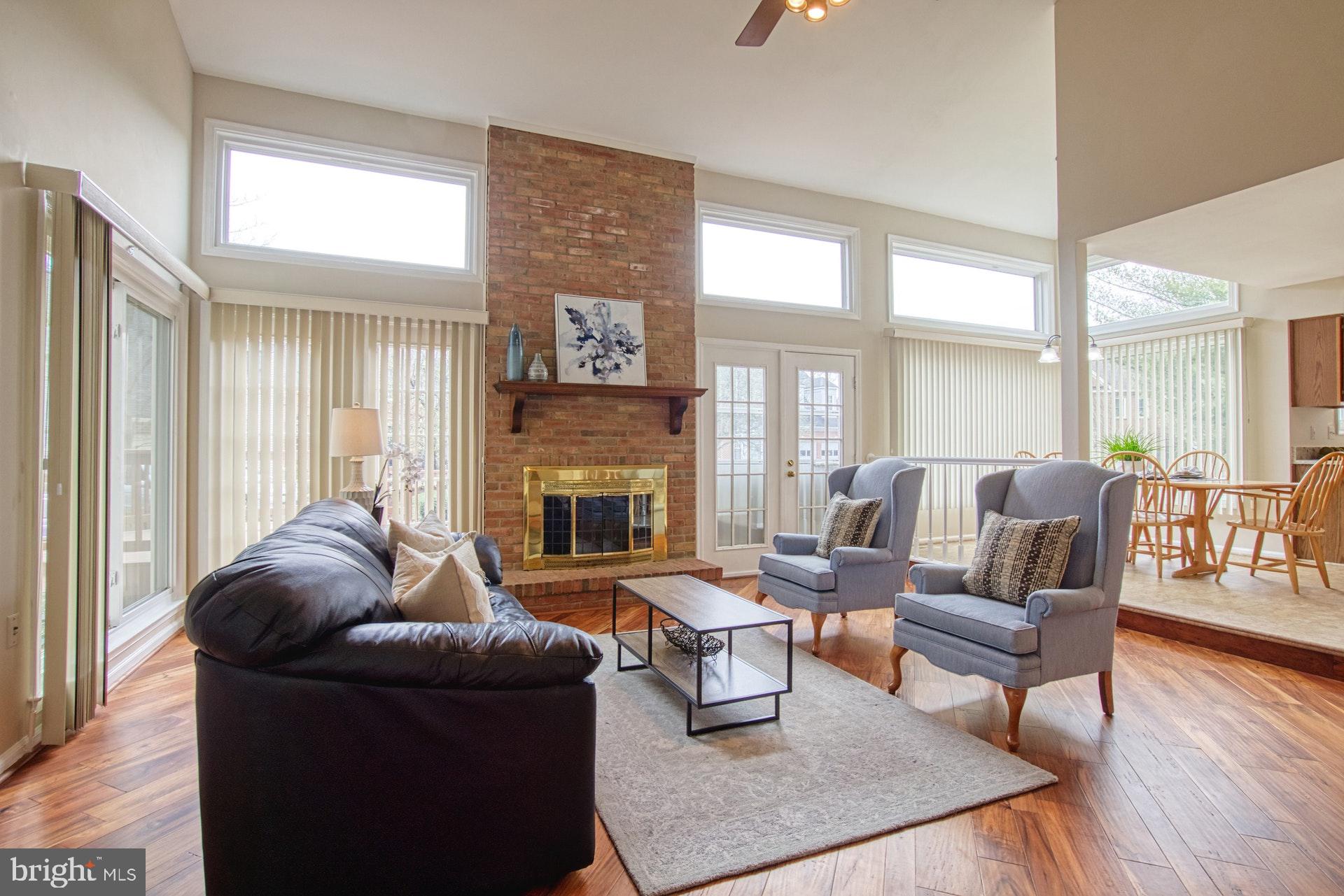 719 Old Hunt Way Herndon, VA 20170 - Photo 5 of 58 Light and Bright Family Room with Walls of Windows