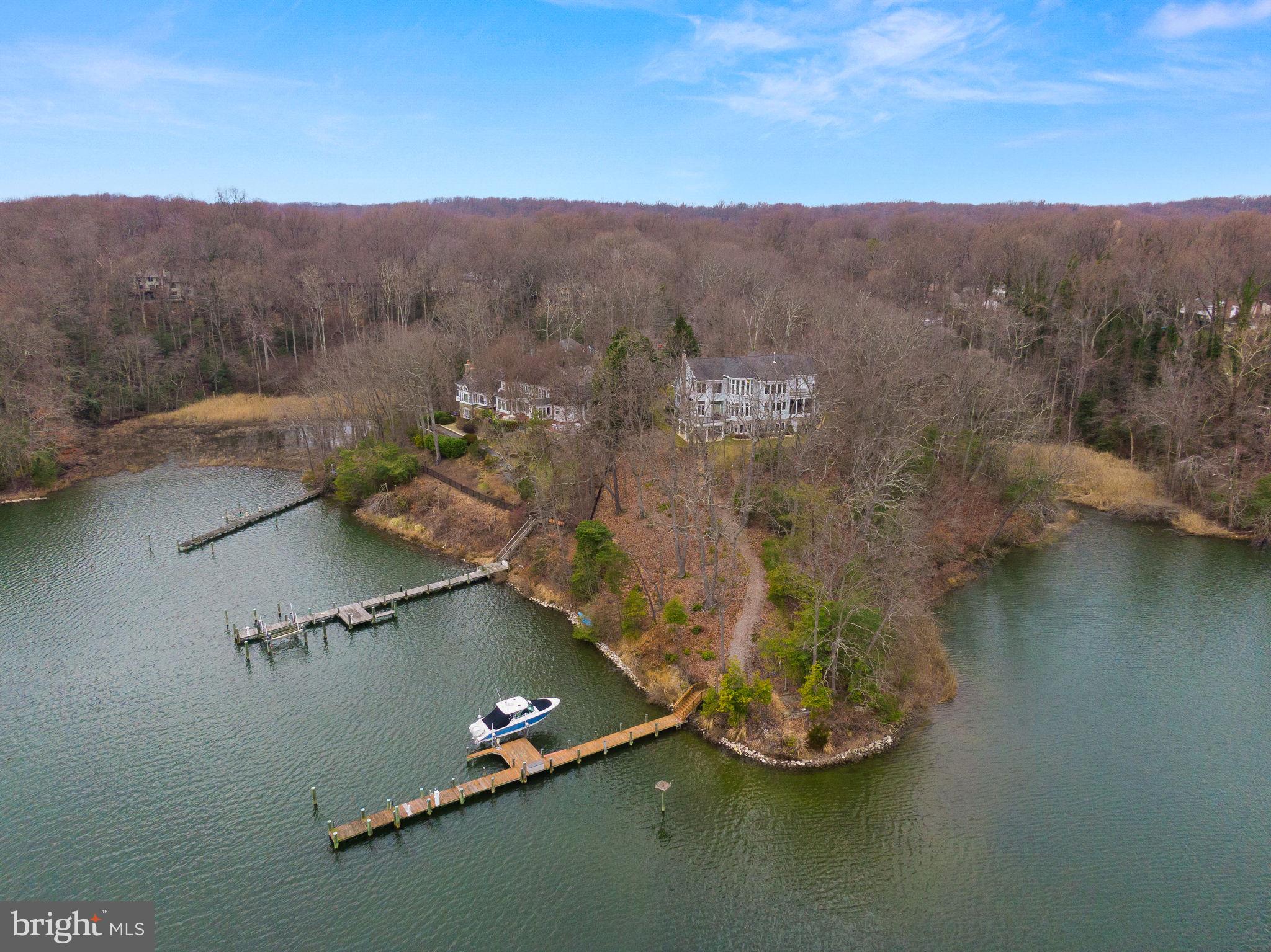 an aerial view of a house with a yard lake view