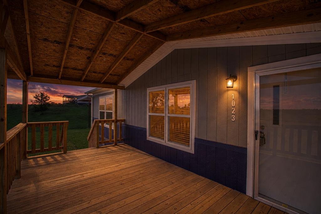 1023 Hopewell Road Bowie, TX 76230 - Photo 5 of 28 a view of a room with wooden floor and windows